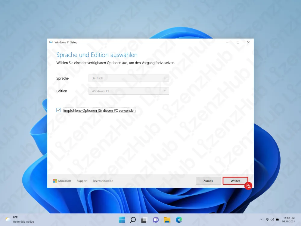 Ein Setup-Bildschirm fordert dazu auf, Sprache und Edition auszuwählen. Die Schaltfläche Weiter ist unten rechts in Rot hervorgehoben. Im Hintergrund sind das Windows-Standard-Wallpaper und die Taskleiste zu sehen.