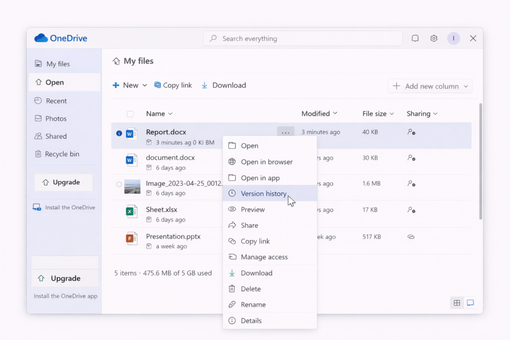 A OneDrive window displays a folder containing several files. Hovering the mouse cursor over Report.docx opens a context menu where the Version History option is highlighted. File details and navigation menus are visible.